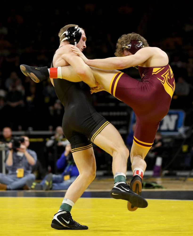 Iowa’s Kaleb Young wrestles Minnesota’s Ryan Thomas at 157 pounds Saturday, February 15, 2020 at Carver-Hawkeye Arena. Young won the match 5-4 in extra time. (Brian Ray/hawkeyesports.com)