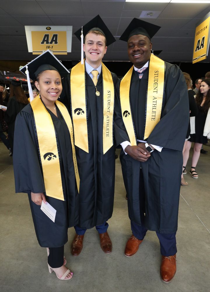 Iowa WoemenÕs BasketballÕs Tania Davis, SwimmingÕs Ben Colin, and FootballÕs James Daniels during the College of Liberal Arts and Sciences spring commencement Saturday, May 11, 2019 at Carver-Hawkeye Arena. (Brian Ray/hawkeyesports.com)