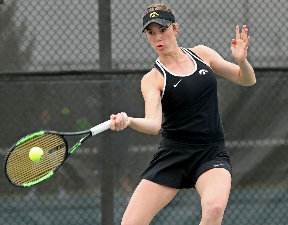 Iowa's Samantha Mannix returns a shot during their doubles match against Rutgers at the Hawkeye Tennis and Recreation Complex in Iowa City on Friday, Apr. 5, 2019. (Stephen Mally/hawkeyesports.com)