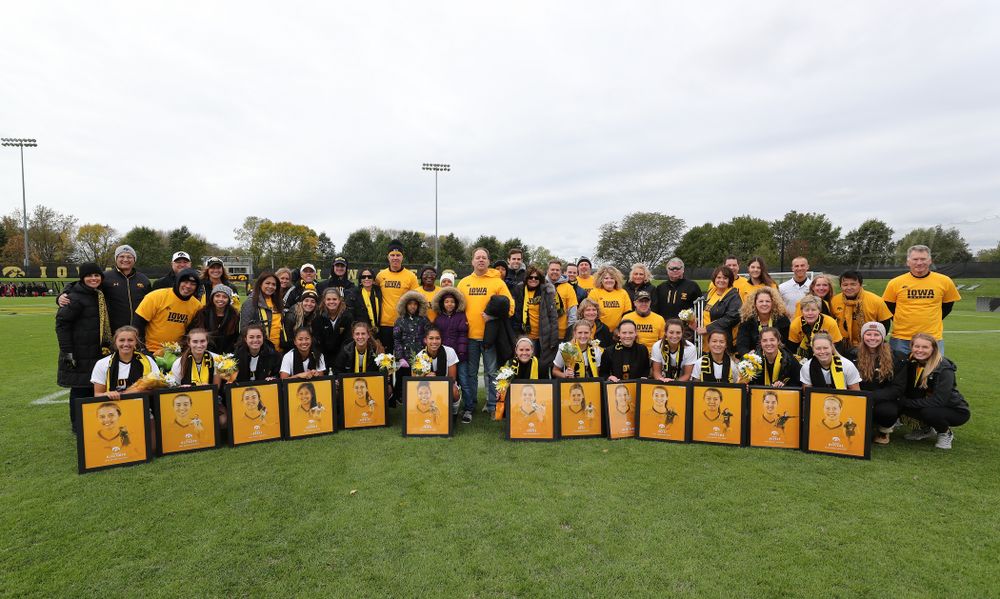 The seniors and their families pose for a photo before their game against the Maryland Terrapins Sunday, October 13, 2019 on senior day. (Brian Ray/hawkeyesports.com)