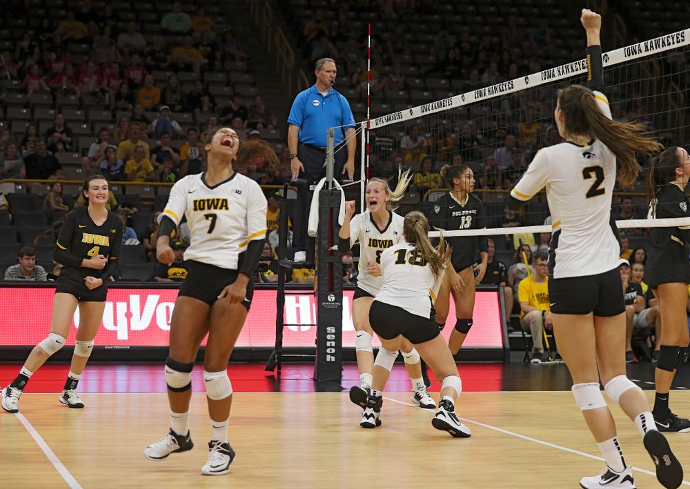 Iowa’s Halle Johnston (4), Brie Orr (7), Hannah Clayton (18), and Courtney Buzzerio (2) celebrate with Kyndra Hansen (8) after her kill during the third set of their Big Ten/Pac-12 Challenge match against Colorado at Carver-Hawkeye Arena in Iowa City on Friday, Sep 6, 2019. (Stephen Mally/hawkeyesports.com)