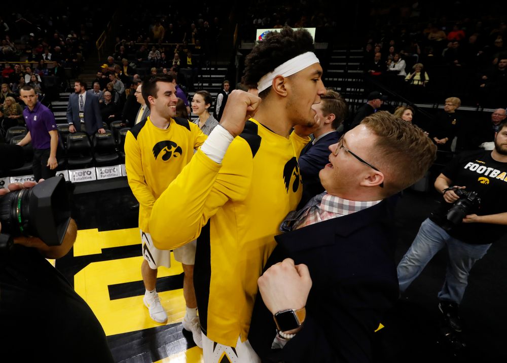 Iowa Hawkeyes forward Cordell Pemsl (35) and manager Lucas Pauley 