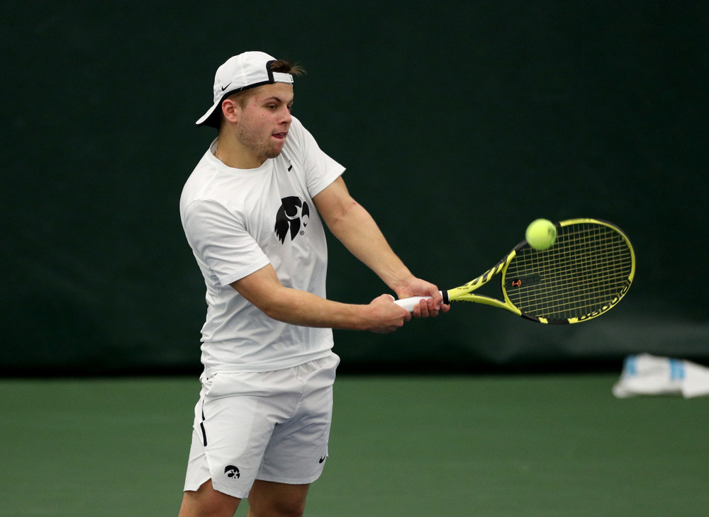 Iowa’s Will Davies against Cornell Sunday, March 8, 2020 at the Hawkeye Tennis and Recreation Center. (Brian Ray/hawkeyesports.com)