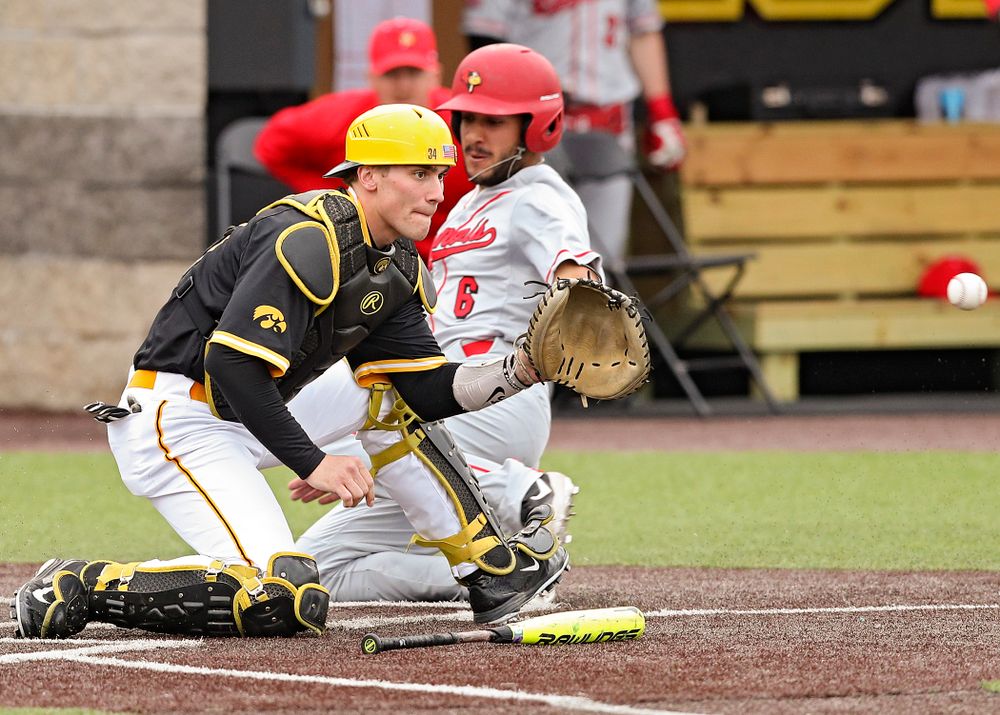 Iowa Hawkeyes catcher Austin Martin (34) looks in a throw during the third inning of their game against Illinois State at Duane Banks Field in Iowa City on Wednesday, Apr. 3, 2019. (Stephen Mally/hawkeyesports.com)