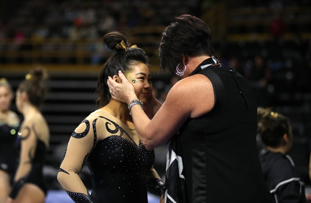 Iowa assistant coach Jennifer Green talks with Clair Kaji following her routine on the beam during their meet against Southeast Missouri State Friday, January 11, 2019 at Carver-Hawkeye Arena. (Brian Ray/hawkeyesports.com)