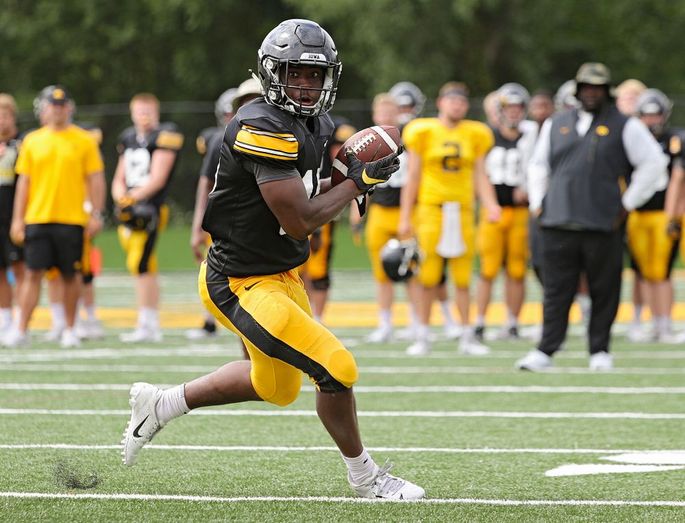 Iowa Hawkeyes running back Tyler Goodson (15) runs after pulling in a pass during Fall Camp Practice No. 10 at the Hansen Football Performance Center in Iowa City on Tuesday, Aug 13, 2019. (Stephen Mally/hawkeyesports.com)
