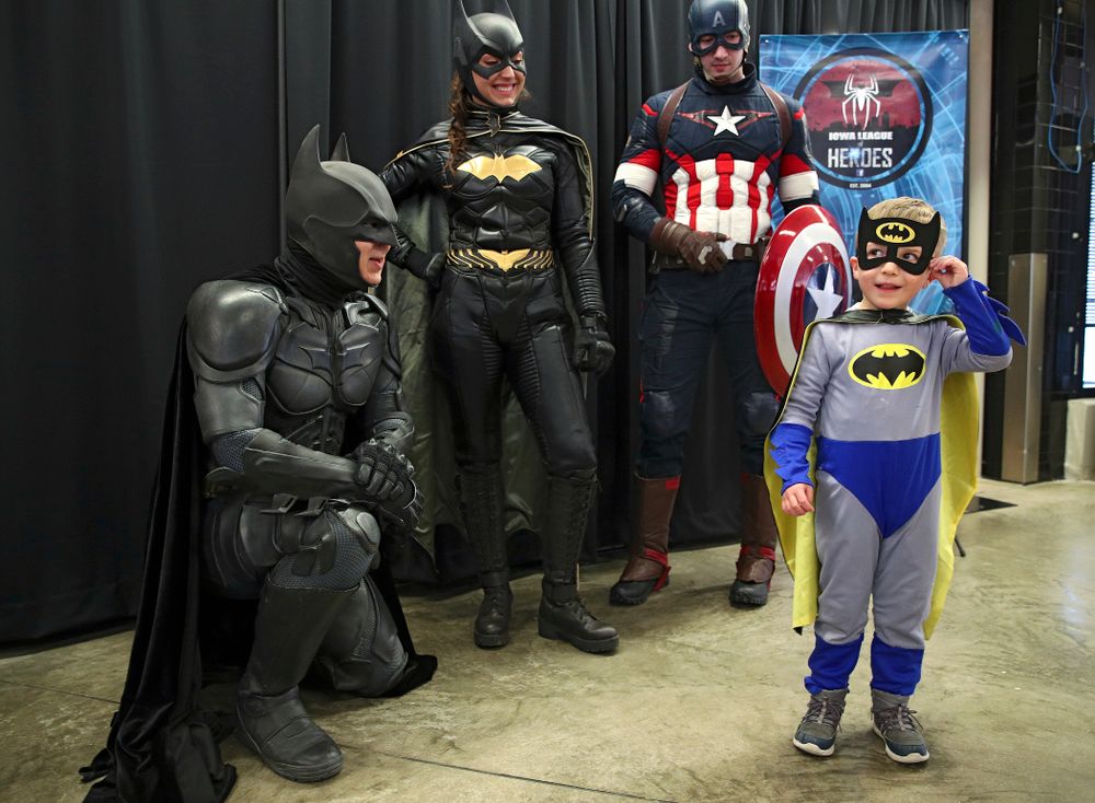 A young fan dressed up as Batman talks with Batman on Superhero and Princess Day before the meet at Carver-Hawkeye Arena in Iowa City on Sunday, March 8, 2020. (Stephen Mally/hawkeyesports.com)