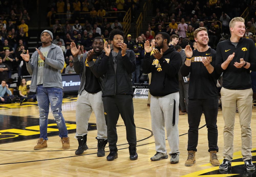 The Hawkeye Football team is introduced during a timeout of the Iowa Hawkeyes game against the Michigan Wolverines Friday, February 1, 2019 at Carver-Hawkeye Arena. (Brian Ray/hawkeyesports.com)