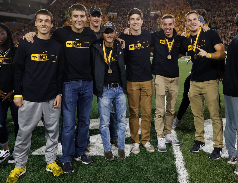 Members of the Iowa men's track and field team are recognized by the Presidential Committee on Athletics at halftime during a game against Wisconsin on September 22, 2018. (Tork Mason/hawkeyesports.com)