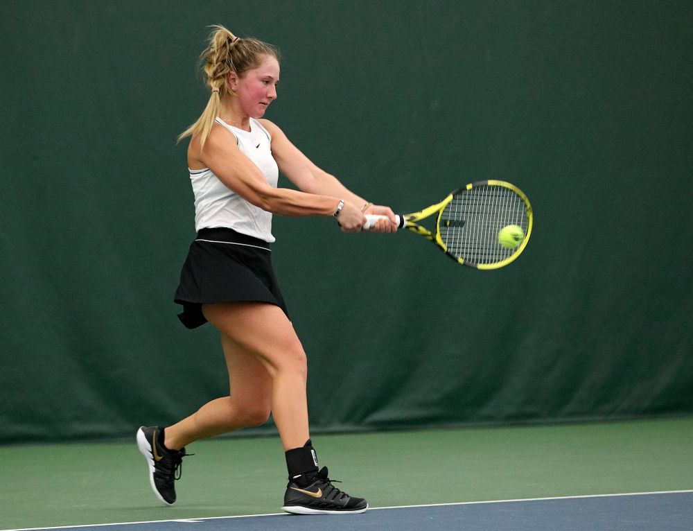 Iowa’s Danielle Burich returns a shot during her singles match at the Hawkeye Tennis and Recreation Complex in Iowa City on Sunday, February 16, 2020. (Stephen Mally/hawkeyesports.com)
