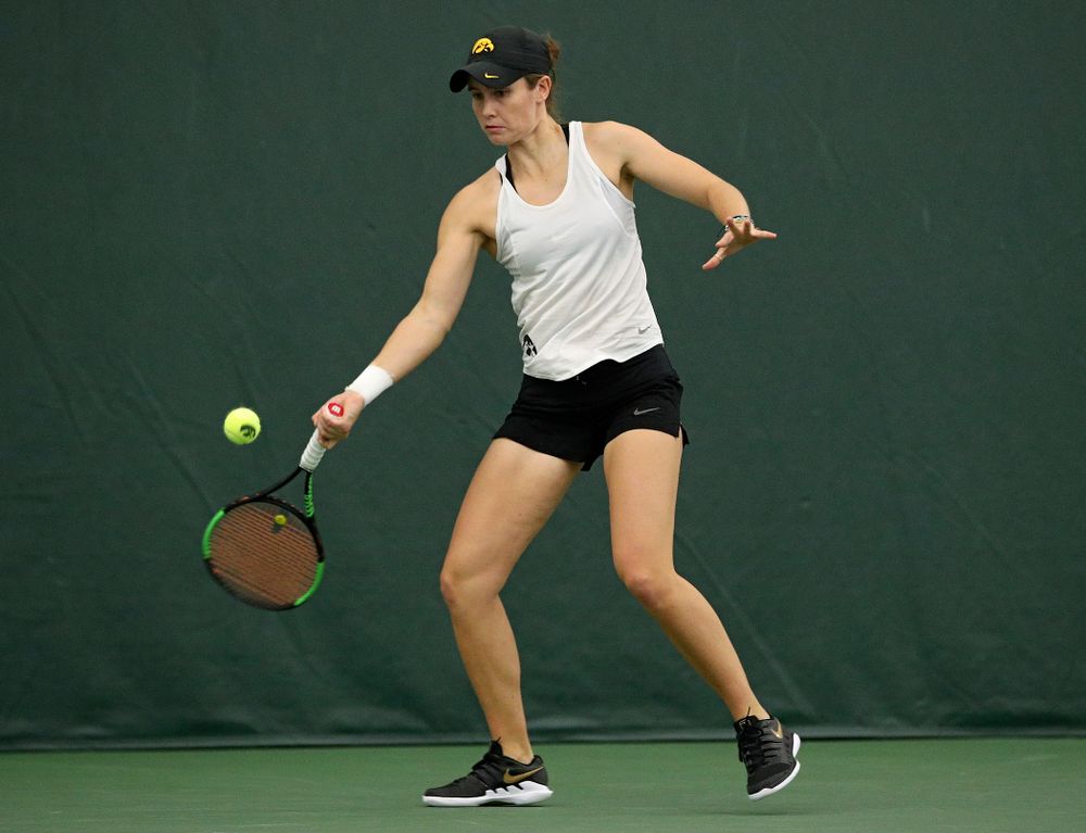 Iowa’s Elise Van Heuvelen returns a shot during her singles match at the Hawkeye Tennis and Recreation Complex in Iowa City on Sunday, February 23, 2020. (Stephen Mally/hawkeyesports.com)