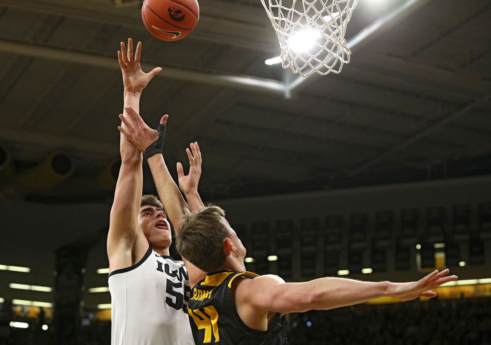 Iowa Hawkeyes center Luka Garza (55) scores a basket during the first half of their their game at Carver-Hawkeye Arena in Iowa City on Sunday, December 29, 2019. (Stephen Mally/hawkeyesports.com)