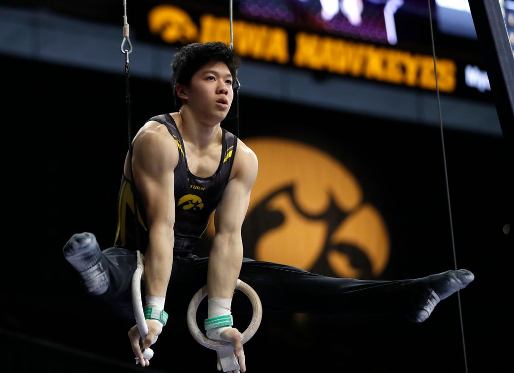 Bennet Huang competes on the rings against Minnesota and Air Force 