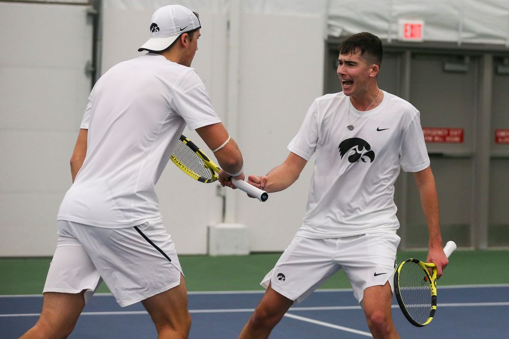 Iowa’s Joe Tyler and Matt Clegg celebrate a point during the Iowa men’s tennis match vs Western Michigan on Saturday, January 18, 2020 at the Hawkeye Tennis and Recreation Complex. (Lily Smith/hawkeyesports.com)