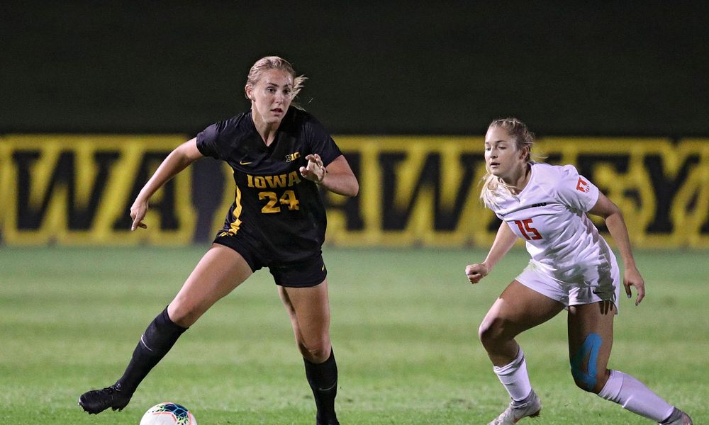 Iowa defender Sara Wheaton (24) gets around a defender during the second half of their match against Illinois at the Iowa Soccer Complex in Iowa City on Thursday, Sep 26, 2019. (Stephen Mally/hawkeyesports.com)