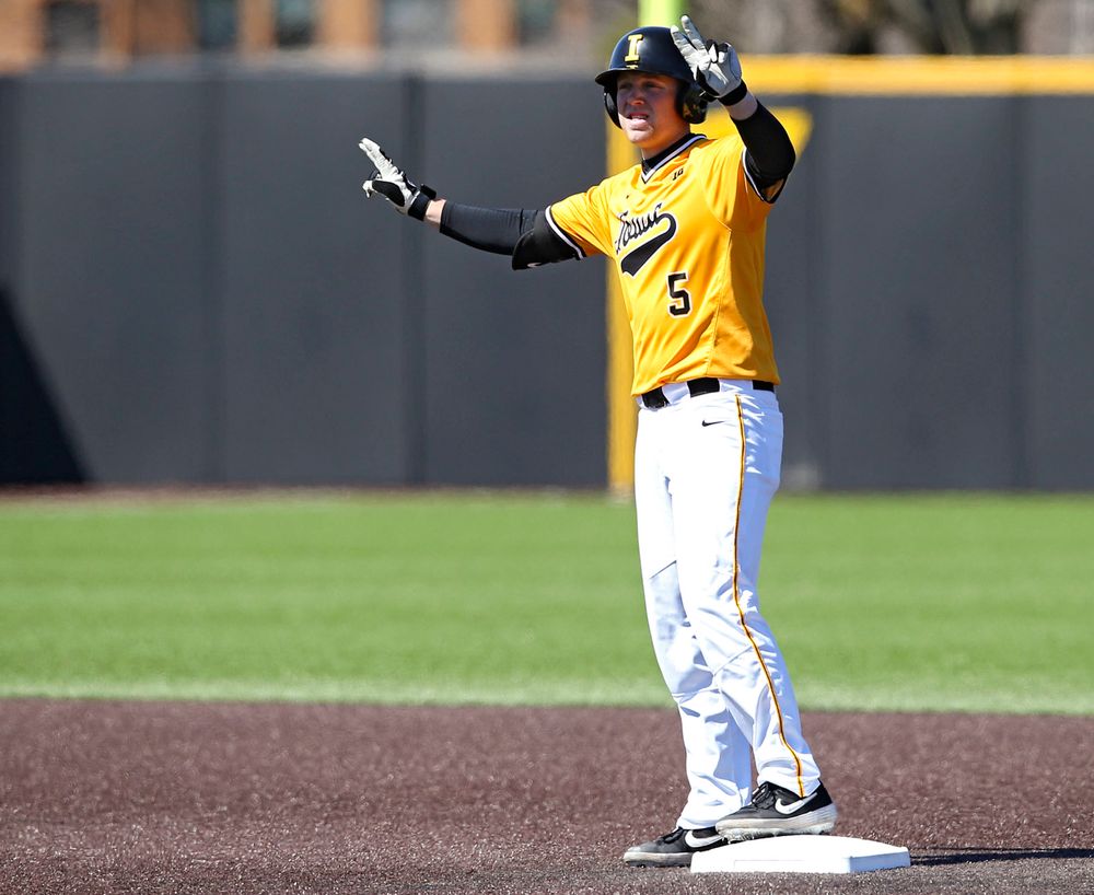 Iowa Hawkeyes first baseman Zeb Adreon (5) holds up two fingers after hitting a double during the fourth inning against Illinois at Duane Banks Field in Iowa City on Sunday, Mar. 31, 2019. (Stephen Mally/hawkeyesports.com)