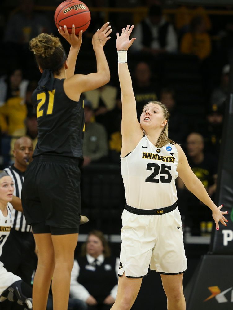 Iowa Hawkeyes center Monika Czinano (25) tries to get her hand on a shot during the second quarter of their second round game in the 2019 NCAA Women's Basketball Tournament at Carver Hawkeye Arena in Iowa City on Sunday, Mar. 24, 2019. (Stephen Mally for hawkeyesports.com)