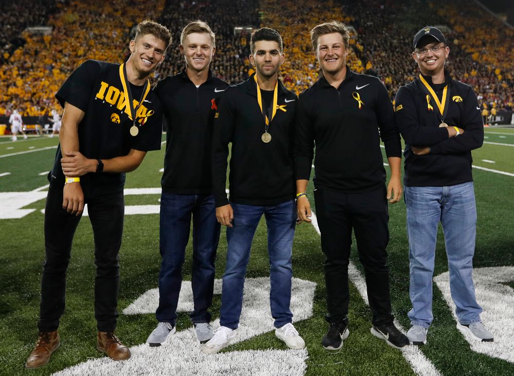 Members of the Iowa men's golf team are recognized by the Presidential Committee on Athletics at halftime during a game against Wisconsin on September 22, 2018. (Tork Mason/hawkeyesports.com)