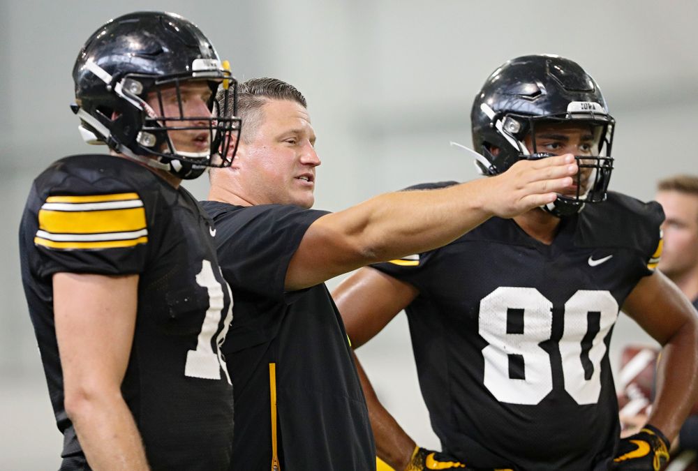 Iowa Hawkeyes offensive coordinator Brian Ferentz  (center) talks with tight end Drew Cook (left) and tight end Josiah Miamen (right) during Fall Camp Practice No. 6 at the Hansen Football Performance Center in Iowa City on Thursday, Aug 8, 2019. (Stephen Mally/hawkeyesports.com)