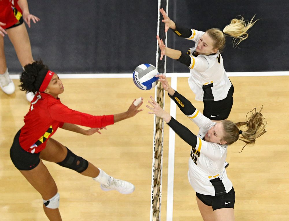 Iowa’s Hannah Clayton (bottom) gets her hand on the ball as Kyndra Hansen tries to reach it during the second set of their match at Carver-Hawkeye Arena in Iowa City on Saturday, Nov 30, 2019. (Stephen Mally/hawkeyesports.com)