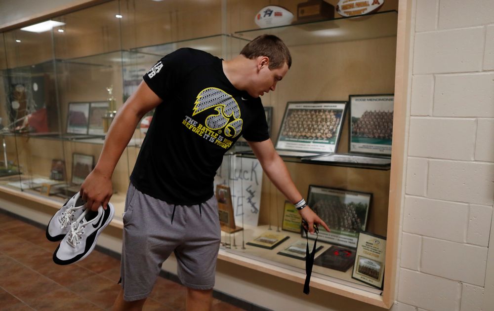 Iowa Hawkeyes quarterback Nathan Stanley (4) looks over the trophy case at his high school Wednesday, May 30, 2018 in Menomonie, Wisc. (Brian Ray/hawkeyesports.com)