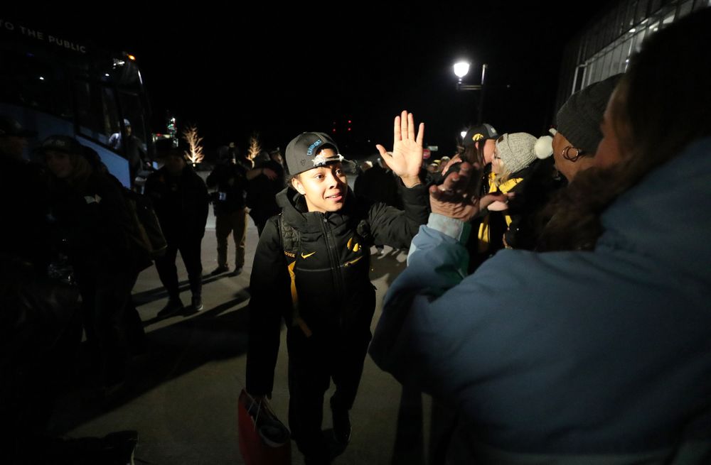Iowa Hawkeyes guard Tania Davis (11) celebrates with fans as they arrive back in Coralville after defeating the Maryland Terrapins in the Big Ten Championship Game Sunday, March 10, 2019 in Indianapolis, Ind. (Brian Ray/hawkeyesports.com)
