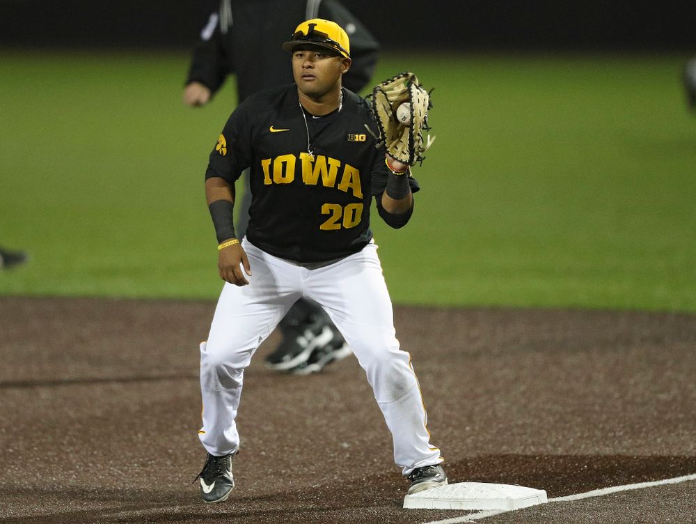 Iowa Hawkeyes first baseman Izaya Fullard (20) pulls in a throw for an out during the seventh inning of their game against Western Illinois at Duane Banks Field in Iowa City on Wednesday, May. 1, 2019. (Stephen Mally/hawkeyesports.com)