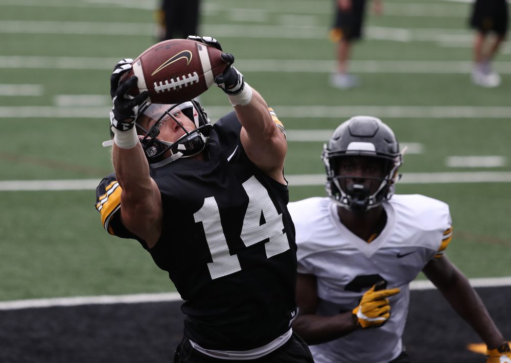 Iowa Hawkeyes wide receiver Kyle Groeneweg (14) and defensive back Trey Creamer (3) during practice No. 4 of Fall Camp Monday, August 6, 2018 at the Hansen Football Performance Center. (Brian Ray/hawkeyesports.com)