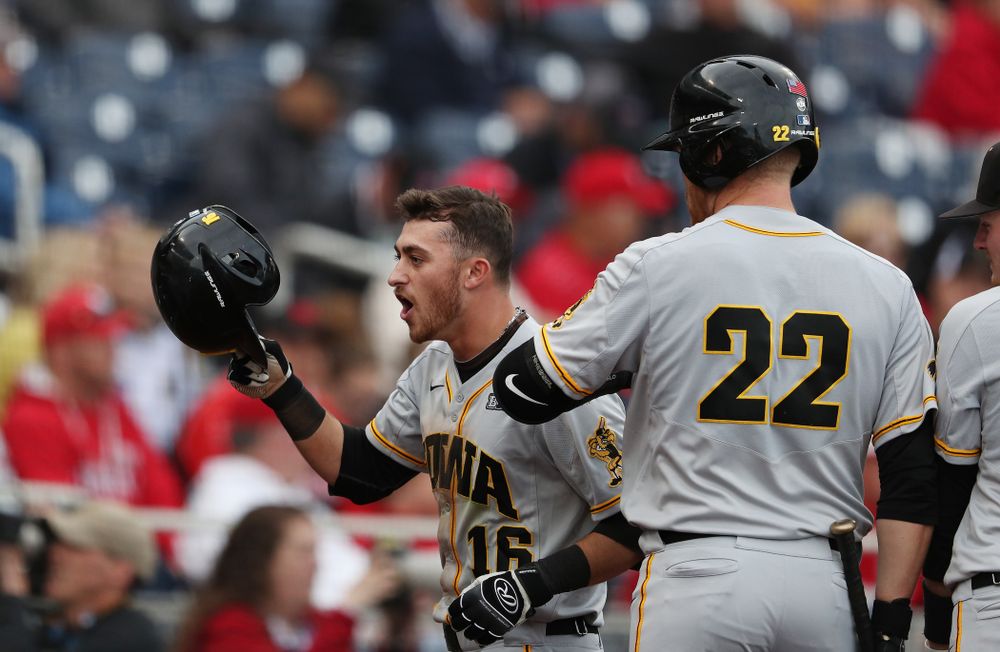 Iowa Hawkeyes Tanner Wetrich (16) celebrates after scoring against the Indiana Hoosiers in the first round of the Big Ten Baseball Tournament Wednesday, May 22, 2019 at TD Ameritrade Park in Omaha, Neb. (Brian Ray/hawkeyesports.com)