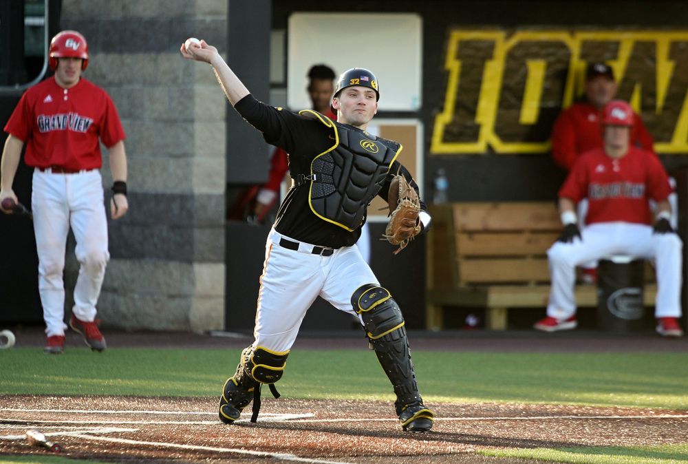 Iowa catcher Brett McCleary (32) throws to first for an out during the third inning of their game at Duane Banks Field in Iowa City on Tuesday, March 3, 2020. (Stephen Mally/hawkeyesports.com)