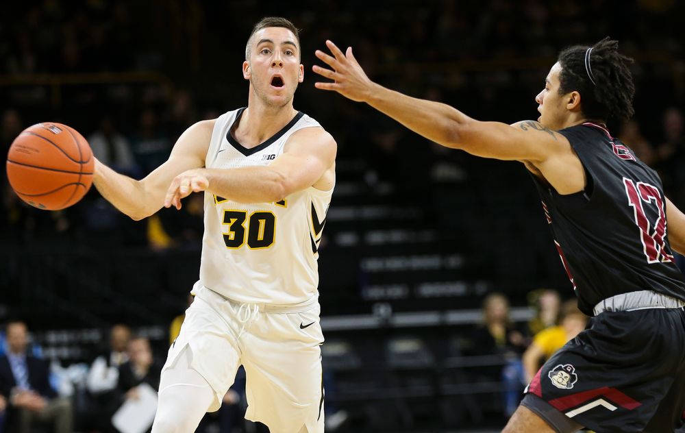 Iowa Hawkeyes guard Connor McCaffery (30) makes a no-look pass during a game against Guilford College at Carver-Hawkeye Arena on November 4, 2018. (Tork Mason/hawkeyesports.com)