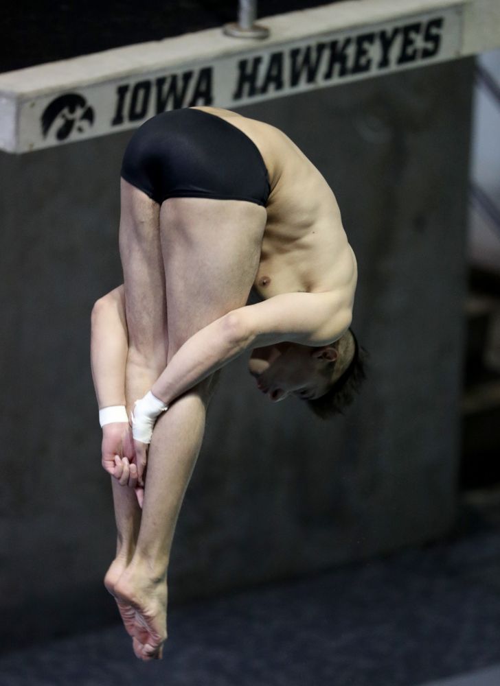 IowaÕs Jonatan Posligua competes on the 1 meter springboard against Notre Dame and Illinois Saturday, January 11, 2020 at the Campus Recreation and Wellness Center.  (Brian Ray/hawkeyesports.com)