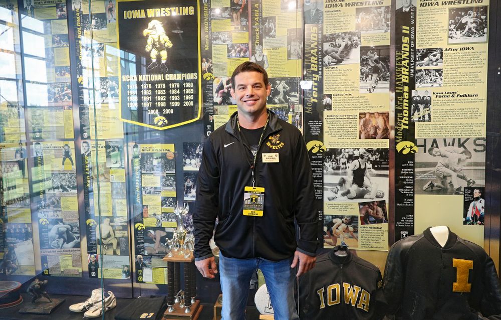 2019 University of Iowa Athletics Hall of Fame inductee Eric Juergens by the wrestling display at the University of Iowa Athletics Hall of Fame in Iowa City on Friday, Aug 30, 2019. (Stephen Mally/hawkeyesports.com)