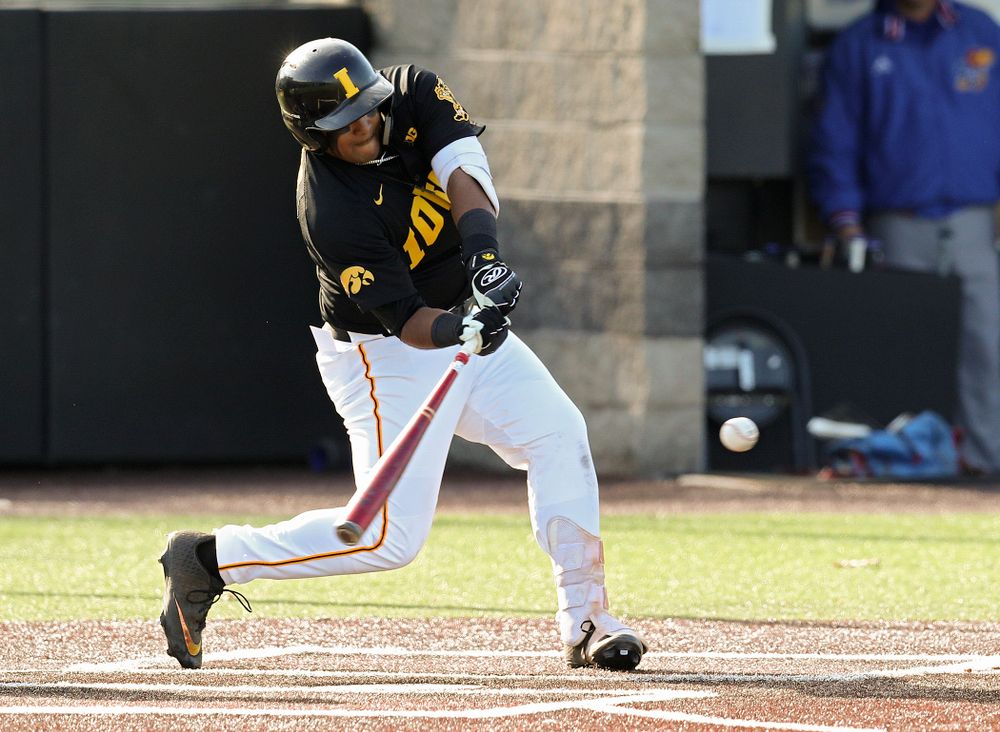 Iowa infielder Izaya Fullard (20) gets a hit during the first inning of their college baseball game at Duane Banks Field in Iowa City on Tuesday, March 10, 2020. (Stephen Mally/hawkeyesports.com)