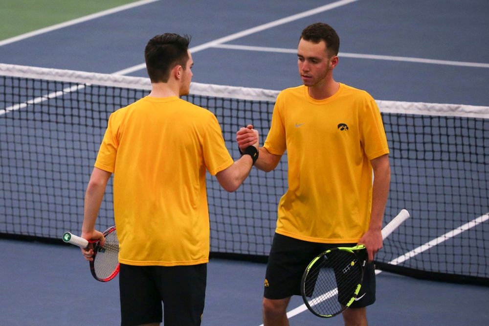 Iowa's Kareem Allaf (right) and Jonas Larsen (left) at a tennis match vs Drake  Friday, March 8, 2019 at the Hawkeye Tennis and Recreation Complex. (Lily Smith/hawkeyesports.com)