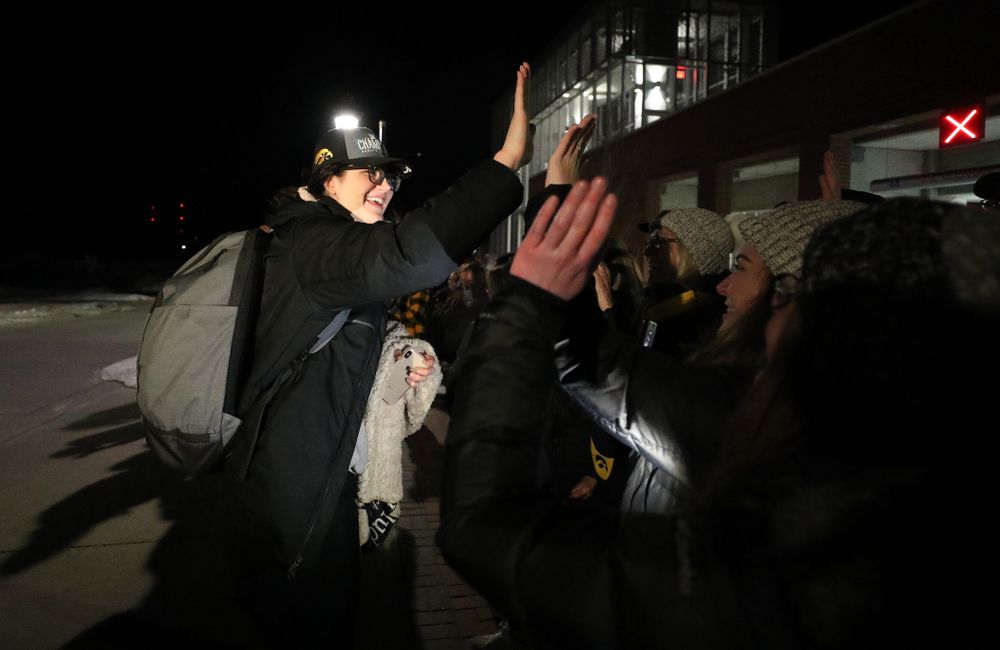 Iowa Hawkeyes forward Megan Gustafson (10) celebrates with fans as they arrive back in Coralville after defeating the Maryland Terrapins in the Big Ten Championship Game Sunday, March 10, 2019 in Indianapolis, Ind. (Brian Ray/hawkeyesports.com)