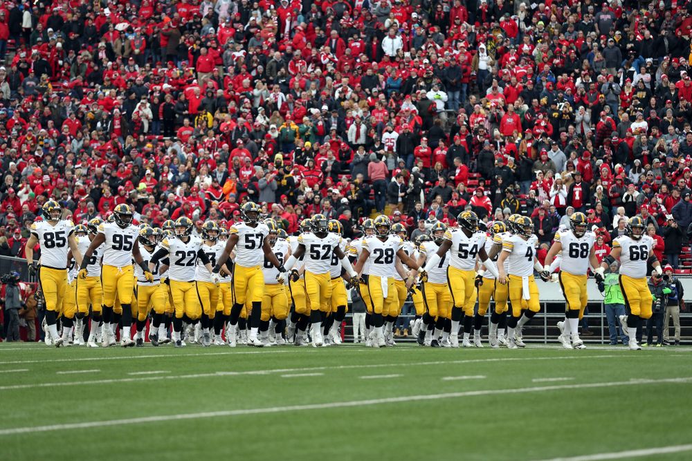 The Iowa Hawkeyes swarm onto the field against the Wisconsin Badgers Saturday, November 9, 2019 at Camp Randall Stadium in Madison, Wisc. (Brian Ray/hawkeyesports.com)