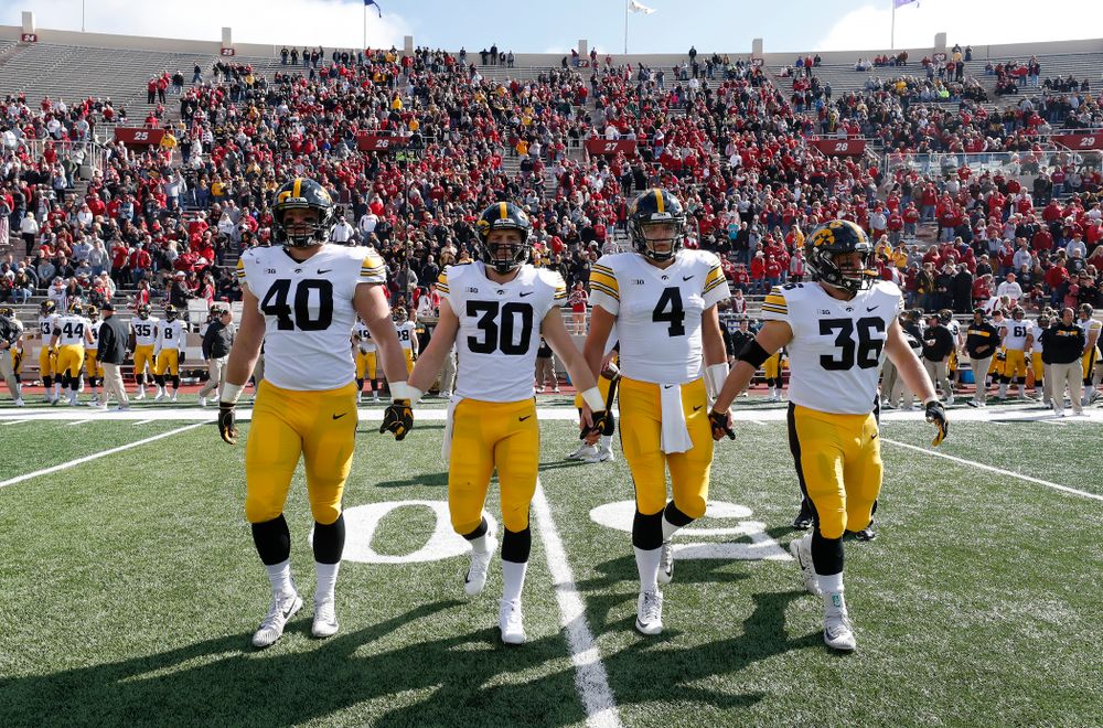 Iowa Hawkeyes captains defensive end Parker Hesse (40), defensive back Jake Gervase (30), quarterback Nate Stanley (4), and fullback Brady Ross against the Indiana Hoosiers Saturday, October 13, 2018 at Memorial Stadium, in Bloomington, Ind. (Brian Ray/hawkeyesports.com)