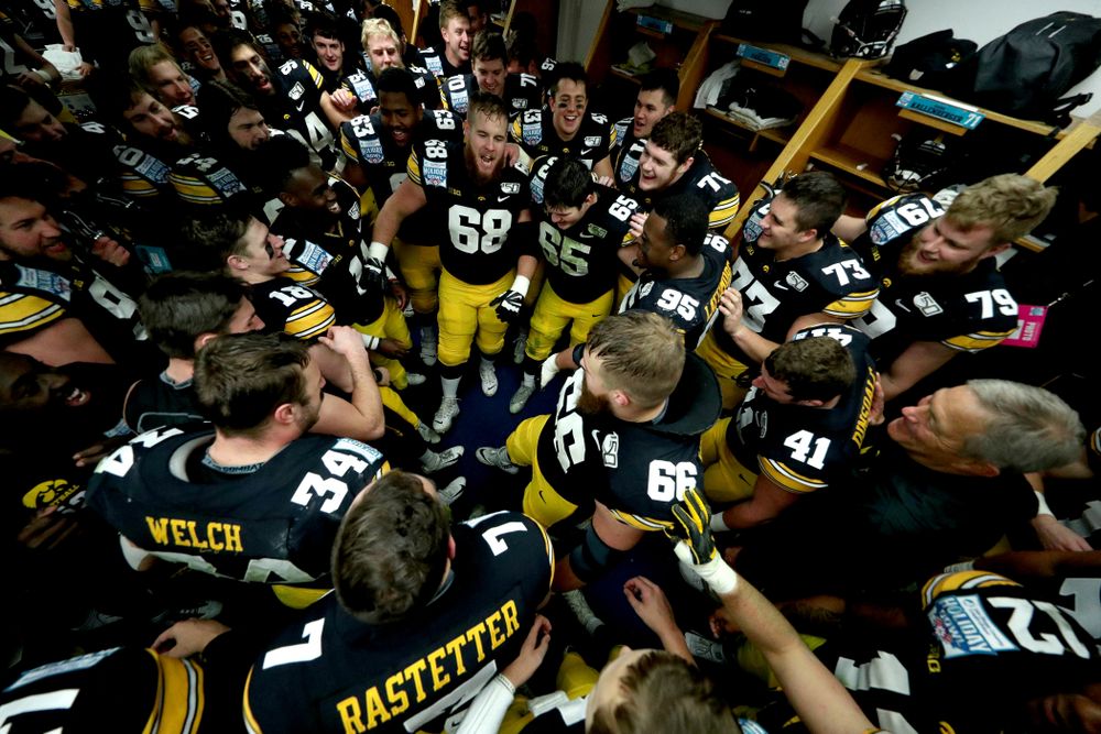 The Iowa Hawkeyes do the Hokey Pokey in the locker room to honor the late Hayden Fry following their win against USC in the Holiday Bowl Saturday, December 28, 2019 at San Diego Community Credit Union Stadium.  (Brian Ray/hawkeyesports.com)