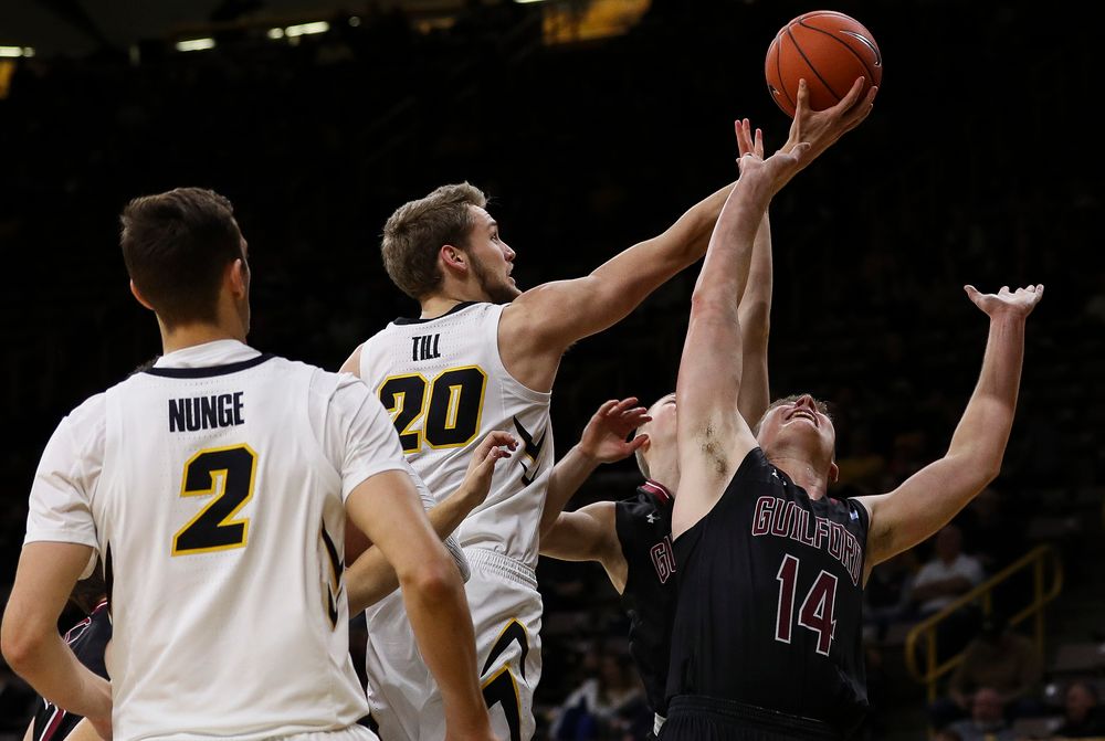 Iowa Hawkeyes forward Riley Till (20) goes up for a rebound during a game against Guilford College at Carver-Hawkeye Arena on November 4, 2018. (Tork Mason/hawkeyesports.com)