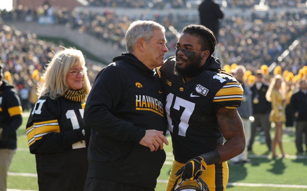 Iowa Hawkeyes defensive back Devonte Young (17) and Kirk and Mary Ferentz during Senior Day festivities before their game against the Illinois Fighting Illini Saturday, November 23, 2019 at Kinnick Stadium. (Brian Ray/hawkeyesports.com)