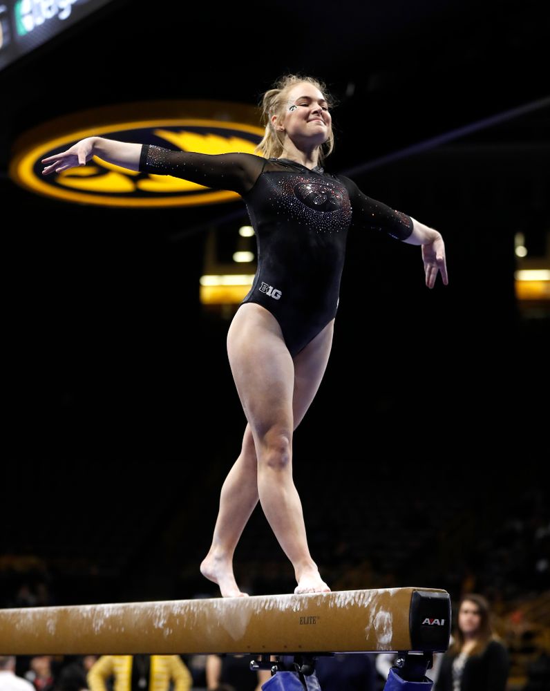Charlotte Sullivan competes on the beam 