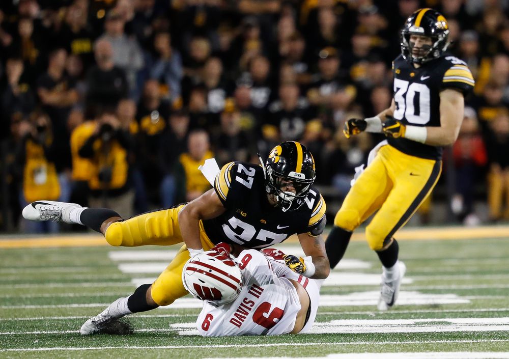 Iowa Hawkeyes defensive back Amani Hooker (27) makes a tackle during a game against Wisconsin at Kinnick Stadium on September 22, 2018. (Tork Mason/hawkeyesports.com)