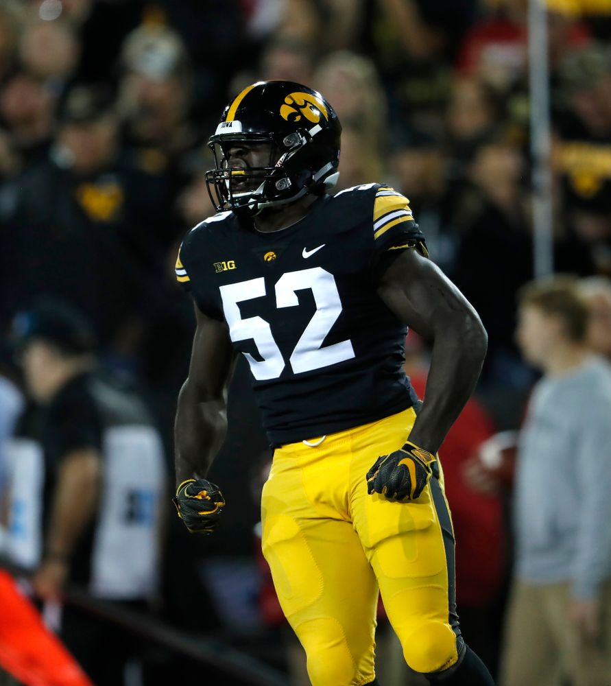 Iowa Hawkeyes linebacker Amani Jones (52) reacts after making a stop against the Wisconsin Badgers Saturday, September 22, 2018 at Kinnick Stadium. (Brian Ray/hawkeyesports.com)