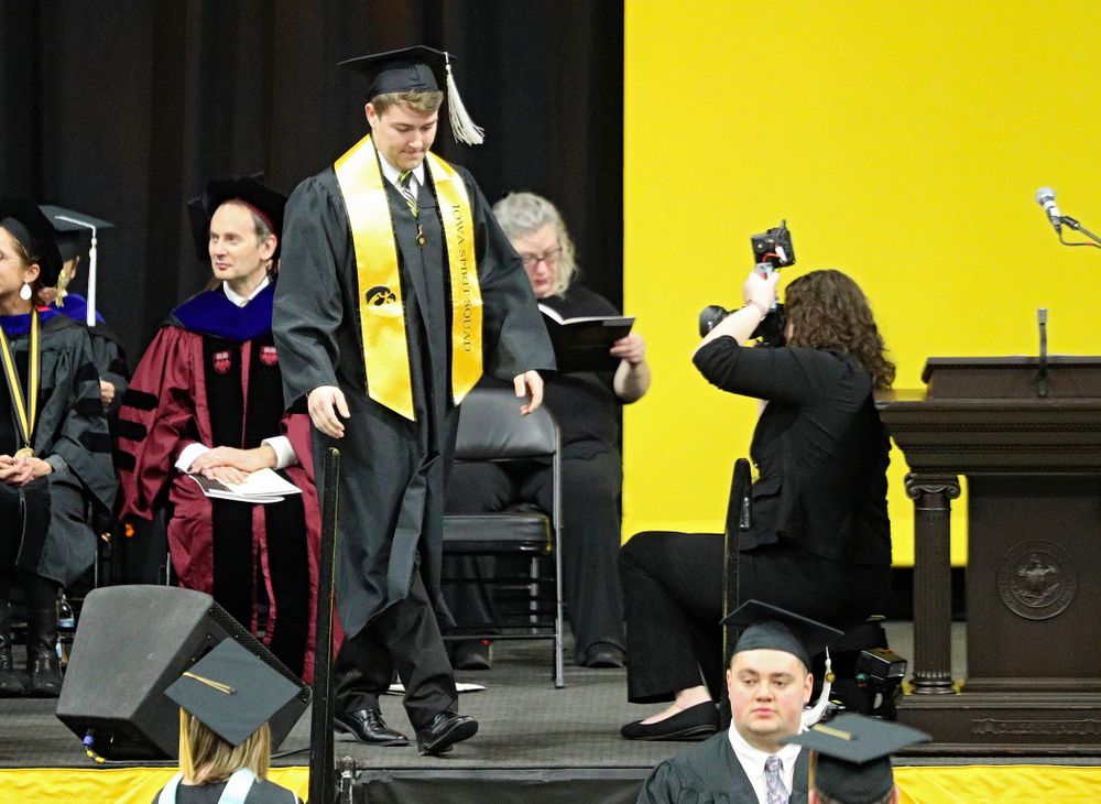 Iowa Spirit Squad’s Joseph Bartemes during the College of Liberal Arts and Sciences and University College Fall 2019 Commencement ceremony at Carver-Hawkeye Arena in Iowa City on Saturday, December 21, 2019. (Stephen Mally/hawkeyesports.com)