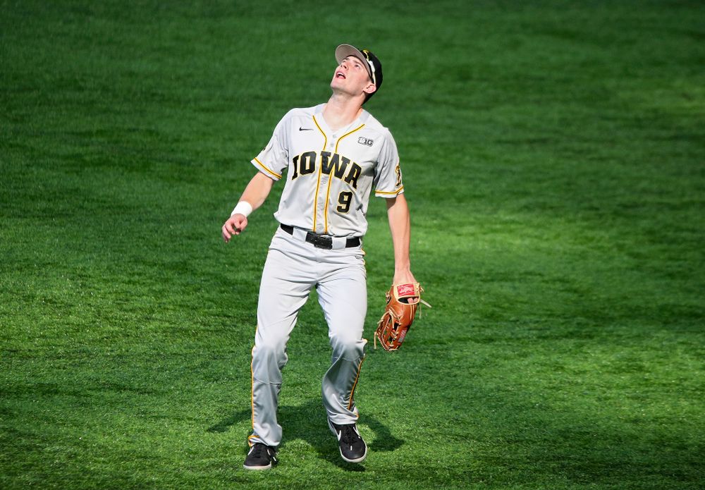 Iowa Hawkeyes outfielder Ben Norman (9) tracks down a fly ball for an out during the second inning of their CambriaCollegeClassic game at U.S. Bank Stadium in Minneapolis, Minn. on Friday, February 28, 2020. (Stephen Mally/hawkeyesports.com)