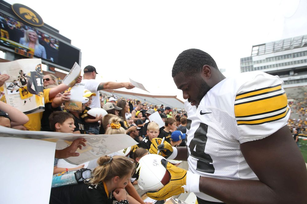 Iowa's Daraun McKinney signs autographs at the Kids Day at Kinnick Stadium on Saturday, August 10, 2019  (Lily Smith/hawkeyesports.com)