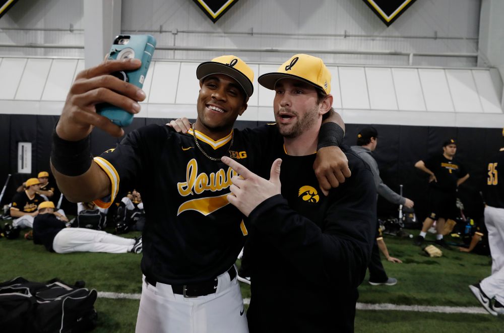 Iowa Hawkeyes third baseman Lorenzo Elion (1) and infielder Chris Whelan (28) during the team's annual media day Thursday, February 8, 2018 in the indoor practice facility. (Brian Ray/hawkeyesports.com)