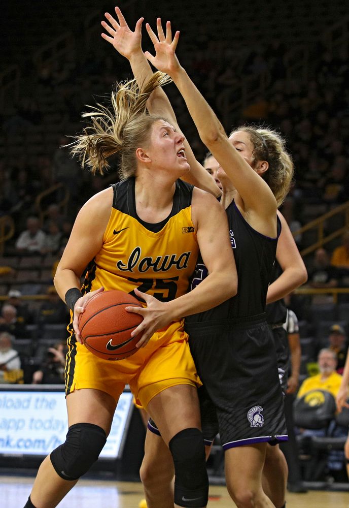 Iowa forward/center Monika Czinano (25) eyes the basket during the second quarter of their game against Winona State at Carver-Hawkeye Arena in Iowa City on Sunday, Nov 3, 2019. (Stephen Mally/hawkeyesports.com)