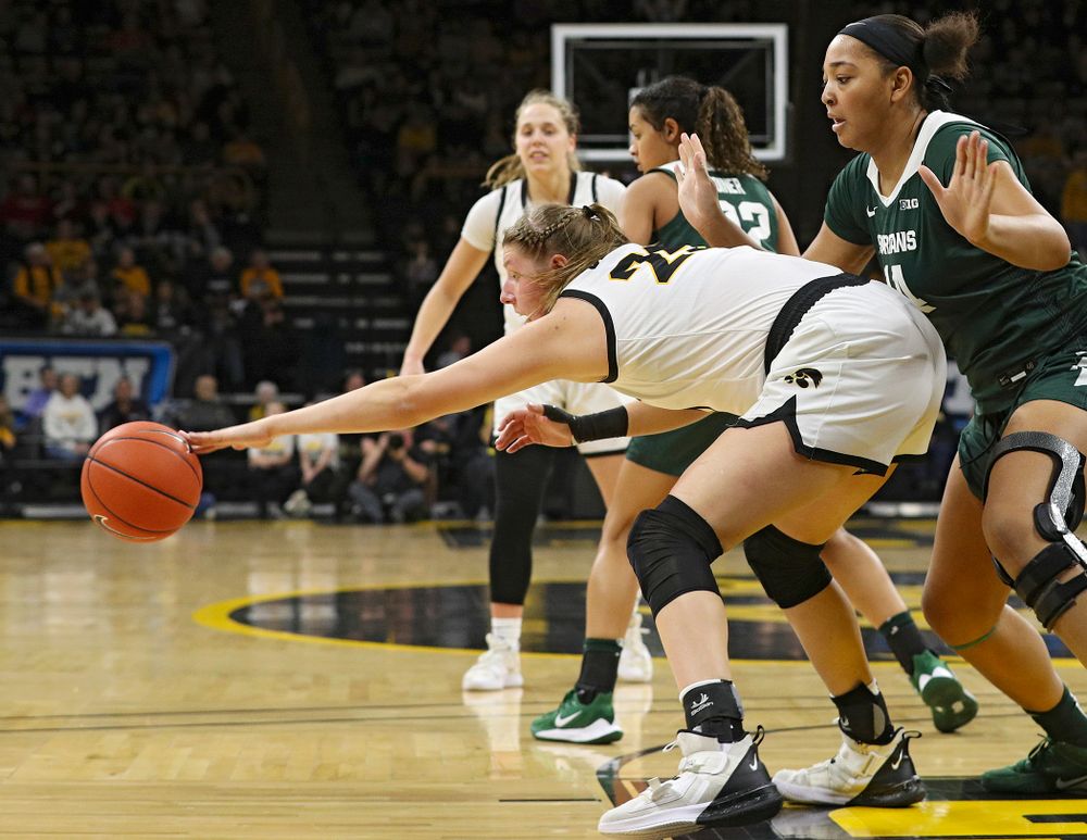 Iowa Hawkeyes forward Monika Czinano (25) grabs a ball during the second quarter of their game at Carver-Hawkeye Arena in Iowa City on Sunday, January 26, 2020. (Stephen Mally/hawkeyesports.com)